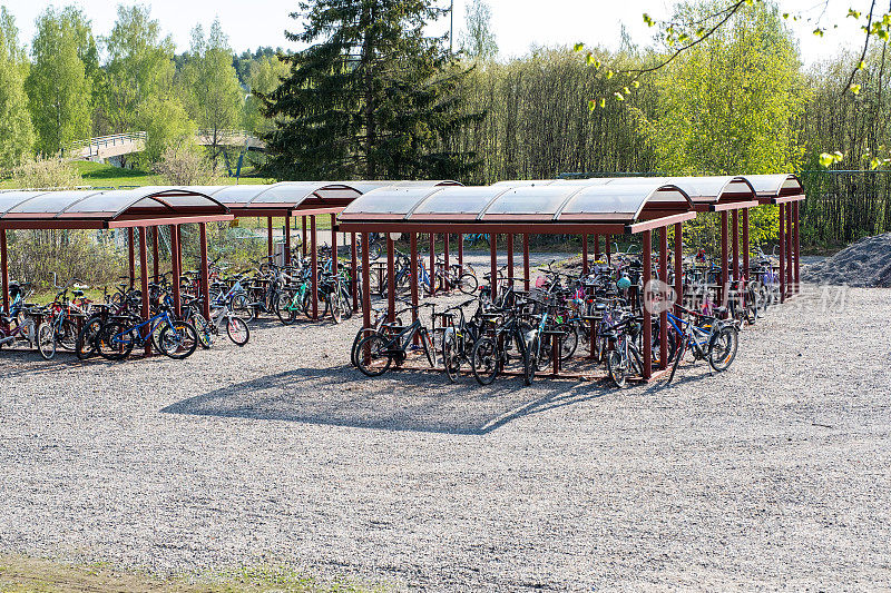 Bicycle parking for schoolchildren in a schoolyard in Lahti, Finland. Summer time of the year.